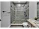 New bathroom featuring a stand-up shower with stone flooring and grey tiling at 729 89Th N Ave, St Petersburg, FL 33702