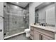 This is a bathroom with a stand-up shower, grey tiling and grey flooring at 729 89Th N Ave, St Petersburg, FL 33702
