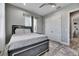 This is a bedroom with grey walls, wood floors, closet and ceiling fan at 729 89Th N Ave, St Petersburg, FL 33702