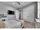 Cozy bedroom with wood floors, closet, television and a vanity with a make-up mirror at 729 89Th N Ave, St Petersburg, FL 33702