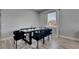 Dining room features a dark wood table, black velvet chairs, and a patterned rug on light wood floors at 729 89Th N Ave, St Petersburg, FL 33702