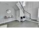 Elegant entryway featuring tile floors, a staircase with modern railing, and stylish decor at 729 89Th N Ave, St Petersburg, FL 33702
