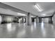 Spacious and well-lit garage with epoxy flooring, ample storage space, and multiple garage door access points at 729 89Th N Ave, St Petersburg, FL 33702