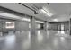 Large garage featuring epoxy flooring, multiple windows for natural light, and ample space for storage at 729 89Th N Ave, St Petersburg, FL 33702