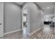 Hallway with open doorway to a bedroom; leading to the common living spaces at 729 89Th N Ave, St Petersburg, FL 33702