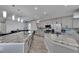 This kitchen features a large island, stainless steel appliances, and grey cabinets at 729 89Th N Ave, St Petersburg, FL 33702