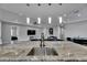 An open concept kitchen with granite counters, pendant lights, and stainless steel faucet at 729 89Th N Ave, St Petersburg, FL 33702