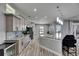 Spacious kitchen features a large island, stainless steel appliances, and modern lighting fixtures at 729 89Th N Ave, St Petersburg, FL 33702