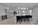 Kitchen with an island featuring bar stool seating, stainless steel appliances, modern cabinets, and granite counters at 729 89Th N Ave, St Petersburg, FL 33702