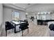 Bright open floor plan with dining area and modern kitchen with bar seating and stainless steel appliances at 729 89Th N Ave, St Petersburg, FL 33702