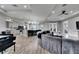 Open floor plan with modern kitchen, spacious living room, and hardwood floors illuminated by recessed lighting at 729 89Th N Ave, St Petersburg, FL 33702
