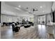 Spacious living room featuring recessed lighting, modern furnishings, and wood-look flooring at 729 89Th N Ave, St Petersburg, FL 33702