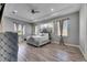 This main bedroom offers hardwood floors, a tray ceiling, and lots of natural light at 729 89Th N Ave, St Petersburg, FL 33702
