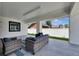 Inviting covered patio features sleek tile flooring, comfortable seating, and relaxing atmosphere at 729 89Th N Ave, St Petersburg, FL 33702