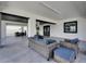 Expansive covered patio with tile flooring and elegant outdoor seating, perfect for entertaining at 729 89Th N Ave, St Petersburg, FL 33702