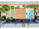 Overhead shot showcasing the community pool, shuffleboard courts and outdoor seating areas at 801 83Rd N Ave # 412, St Petersburg, FL 33702