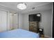 Bright bedroom features a large window, neutral walls, and a wooden dresser at 801 83Rd N Ave # 412, St Petersburg, FL 33702
