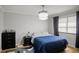 Cozy bedroom with a comfortable bed, stylish chandelier, and ample natural light at 801 83Rd N Ave # 412, St Petersburg, FL 33702