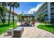 Expansive courtyard featuring manicured lawns, outdoor seating and grill, perfect for community gatherings at 801 83Rd N Ave # 412, St Petersburg, FL 33702
