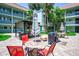 Inviting courtyard featuring outdoor seating, grill, and lush landscaping for relaxing and entertaining at 801 83Rd N Ave # 412, St Petersburg, FL 33702