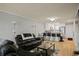 Open concept living room and kitchen area with a view of the modern kitchen features at 801 83Rd N Ave # 412, St Petersburg, FL 33702