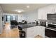 Open concept living room and kitchen area with a clear view of the furniture in the room at 801 83Rd N Ave # 412, St Petersburg, FL 33702