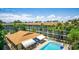 A refreshing community pool with lounge chairs, tables, and a covered area, perfect for relaxation at 801 83Rd N Ave # 412, St Petersburg, FL 33702