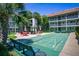 A shuffleboard court surrounded by lush landscaping, seating, and shade, great for community fun at 801 83Rd N Ave # 412, St Petersburg, FL 33702