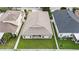 An aerial view of a home displaying the back yard layout and neighboring houses at 8104 Abbey Mist Cv, Tampa, FL 33619