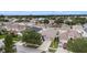 An aerial shot captures the home's location nestled among lush greenery and neatly arranged neighborhood streets at 8104 Abbey Mist Cv, Tampa, FL 33619