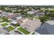 An aerial perspective highlights the home's location in a well-maintained community with neatly arranged properties at 8104 Abbey Mist Cv, Tampa, FL 33619