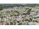 Overhead neighborhood shot showcasing a lake and the community's layout of homes and roadways at 8104 Abbey Mist Cv, Tampa, FL 33619