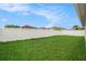 Fenced backyard featuring a well-maintained lawn, perfect for outdoor activities and privacy at 8104 Abbey Mist Cv, Tampa, FL 33619