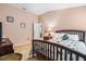 A cozy bedroom with a comfortable bed and stylish bedside table, providing a relaxing retreat at 8104 Abbey Mist Cv, Tampa, FL 33619