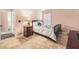 A cozy bedroom with a comfortable bed and stylish bedside table, providing a relaxing retreat at 8104 Abbey Mist Cv, Tampa, FL 33619