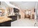 Well-lit kitchen with stainless steel appliances and tile flooring, perfect for cooking and dining at 8104 Abbey Mist Cv, Tampa, FL 33619
