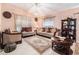Bright living room with tile floors, comfortable seating, and natural light at 8104 Abbey Mist Cv, Tampa, FL 33619