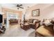 Living room featuring tile floors, a large window, and comfortable seating at 8104 Abbey Mist Cv, Tampa, FL 33619