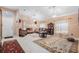 Spacious living room featuring tile flooring, decorative rugs, and elegant furnishings with natural light at 8104 Abbey Mist Cv, Tampa, FL 33619