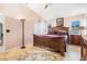 Bedroom featuring a ceiling fan, tile floors, and a large window at 8104 Abbey Mist Cv, Tampa, FL 33619