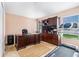 Home office with desk, chair, shelving, storage and workout equipment, offering a versatile workspace at 8104 Abbey Mist Cv, Tampa, FL 33619