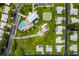 Aerial view of a community featuring a pool, shuffleboard and mature landscaping at 9548 141St St, Seminole, FL 33776