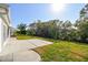 Spacious backyard featuring a concrete patio and well-maintained lawn at 9548 141St St, Seminole, FL 33776