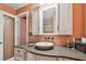 Bathroom featuring a stylish vanity with a vessel sink, updated cabinets, and a walk-in shower at 9548 141St St, Seminole, FL 33776
