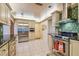 Bright kitchen with stainless steel appliances, custom cabinets, and ample counter space at 9548 141St St, Seminole, FL 33776