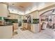 Well-appointed kitchen with custom cabinets and seamless transition to dining area at 9548 141St St, Seminole, FL 33776