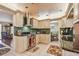 Stylish kitchen with stainless steel appliances, custom cabinets, and mosaic backsplash at 9548 141St St, Seminole, FL 33776