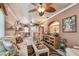 Cozy living room with ceiling fan, comfortable seating, and stylish decor at 9548 141St St, Seminole, FL 33776