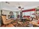 Comfortable living room with hardwood floors, ceiling fan, and classic decor at 9548 141St St, Seminole, FL 33776