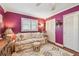 Comfortable living room with a patterned rug, a sofa, and a window with blinds at 9548 141St St, Seminole, FL 33776
